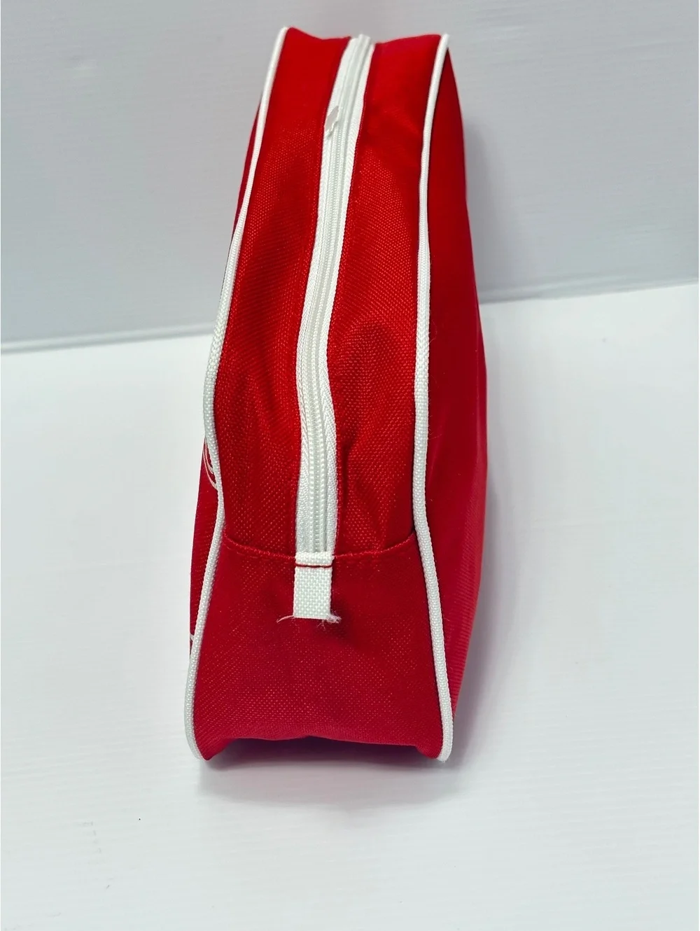 Clinique Red Canvas Cosmetic Bag with White Image Stitching and Zipper Closure
